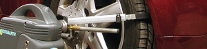 A close up of the wheel alignment tool
