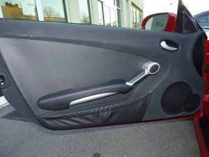 A car door handle with a wrench in it